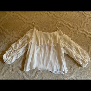 Off white cold shoulder blouse.